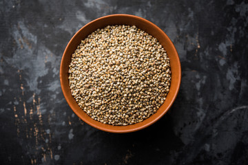 Pearl Millet or Bajra seeds also known as sorghum, in a bowl, selective focus