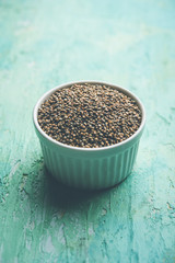 Pearl Millet or Bajra seeds also known as sorghum, in a bowl, selective focus