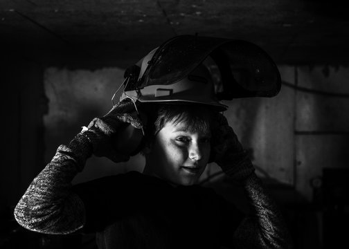 Little Boy Repairs Water Boilers In Basement