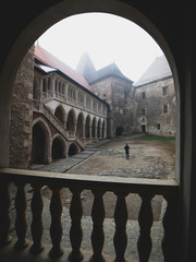 interior and exterior of the Hunedoara castle in Romania in foggy conditions