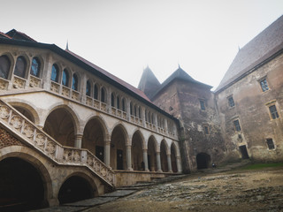 Fototapeta na wymiar interior and exterior of the Hunedoara castle in Romania in foggy conditions