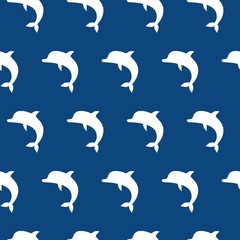 Vector seamless pattern with cute jumping dolphins white on blue background