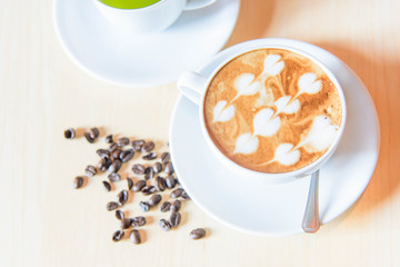 hot coffee on table / hot cappuccino with nice pattern milk foam 