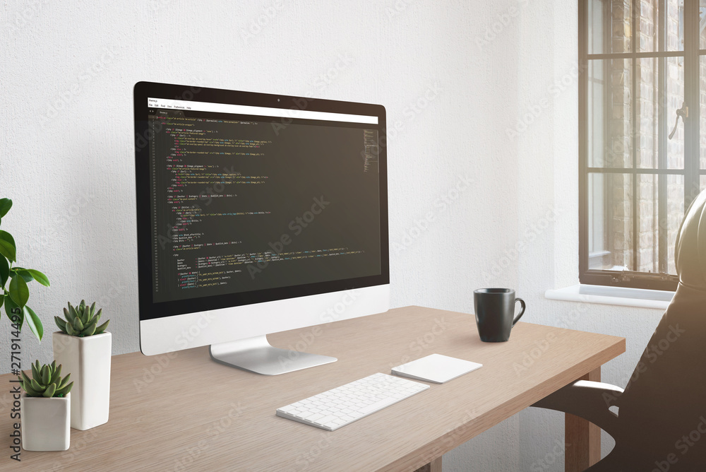 Poster Freelancer workplace concept. Computer display with open code editor. Plants, and cup of coffee on desk.