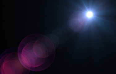 Lens flare light over black background.
