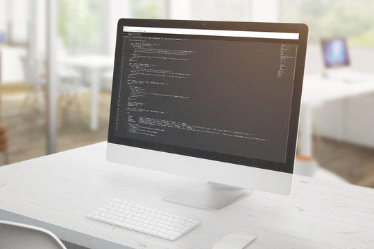 Computer display close-up with a development code editor and some javascript code.