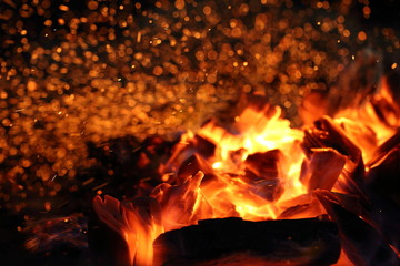 Fire and red burning coals in the grill