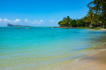 Fototapeta na wymiar Typical tropical beach Mauritius. Relaxing on remote Paradise beach,typical tropical beach at Mauritius island