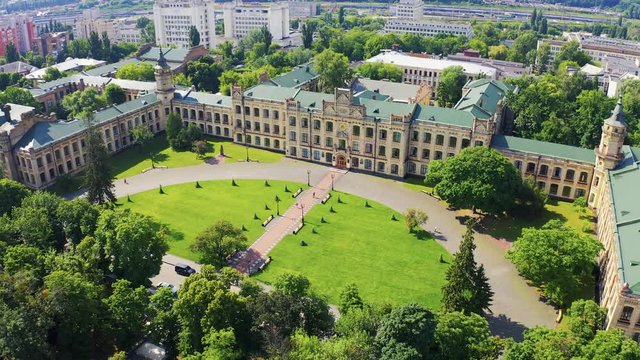 Aerial footage orbiting Kiev Polytechnic Institute with sunshine during summer. Main campus of KPI 4k