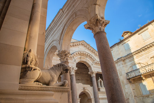 Split, Croatia, peristyle or peristil inside Diocletian Palace in the old town, statues of stone lions and arches from ancient Roman times