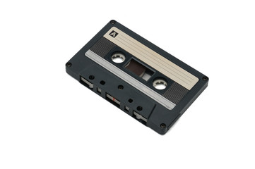 Compact audio tapes for magnetic recording on a white background.Compact cassettte
