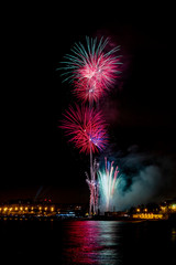 fireworks at night next to the beach