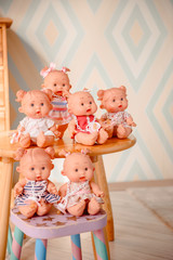 Group of cute baby dolls  on bright background