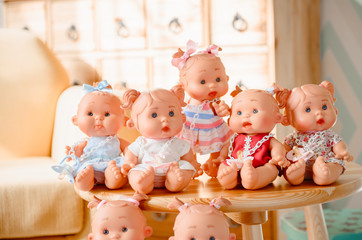 Group of cute baby dolls  on bright background