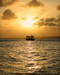 Fototapeta na wymiar Boat at Sunset - Pipa Beach - RN - Brazil