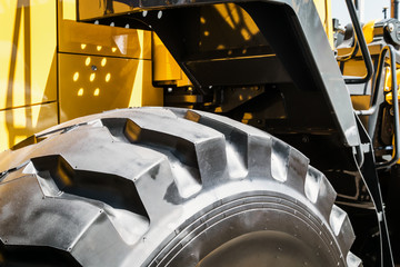 large tires with deep treads mounted on a tractor, dump truck or bulldozer