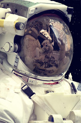 Portrait of the astronaut. Astronaut and camera. Spaceman close up. Elements furnished by NASA.