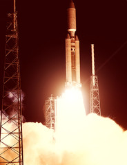 Spaceship launch in clouds. Rocket liftoff into space. The elements of this image furnished by NASA.