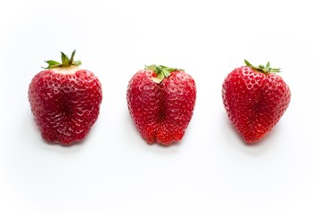 Fresh three strawberries isolated in white background