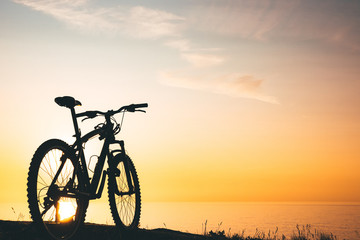 silhouette of a bicycle at sunset.