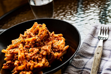 Mediterranean diet. Dish of macaroni with tomato sauce.