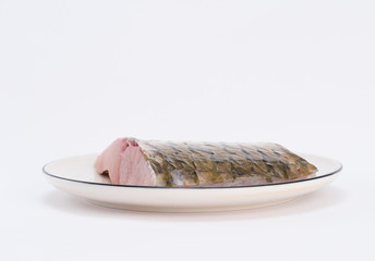 Fillet of fish on white dish