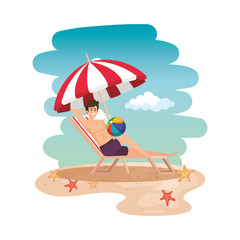 young man relaxing in beach chair with balloon toy on the beach