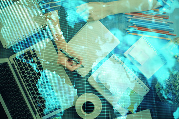 International business hud over woman's hands writing background. Concept of hard work. Double exposure