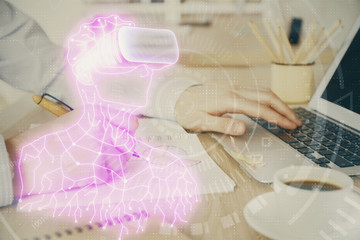 AR hologram with man working on computer on background. Augmented reality concept. Double exposure.