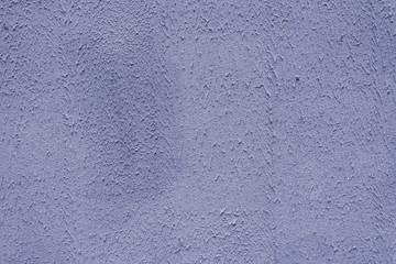 Fototapeta na wymiar The main trend of the purple, lilac style of the concept. Plaster dirty purple wall pattern, decorative texture of the old plaster wall, stucco. Home exterior decor