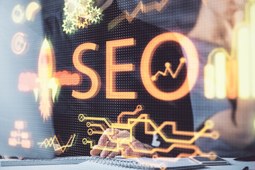 Multi exposure of seo icon with man working on computer on background. Concept of search engine...