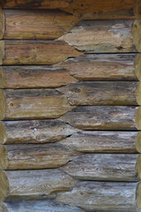 Textured wooden wall, country house close-up. front view. background of wooden planks, folded horizontally.