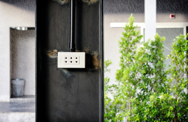 Outdoor Electrical Socket in the Rain.