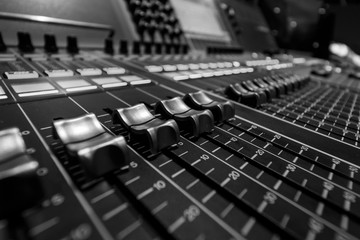 Closeup view of Faders on Professional Audio Digital Sound Mixing Control Console.