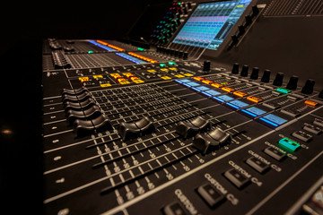 Closeup view of Faders on Professional Audio Digital Sound Mixing Control Console.
