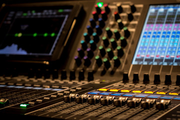 Closeup view of Faders on Professional Audio Digital Sound Mixing Control Console.