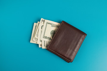 Male wallet with banknotes studio image. Leather wallet with dollar bills.