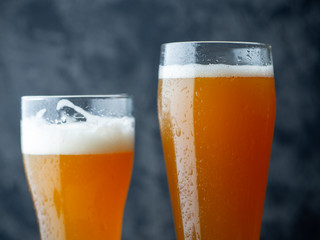 Two glasses of craft beer with mango juice