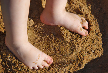 baby feet in the sand