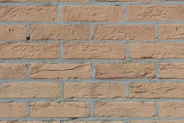 Closeup of dirty washed out yellow brown brick wall texture