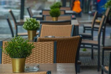 Exterior of a cafeteria with tables and chairs in london.