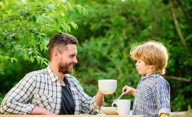 healthy food. Family day bonding. they love eating together. Weekend breakfast. organic and natural food. small boy child with dad. father and son eat outdoor. Just smile
