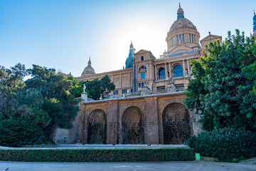 Fototapeta na wymiar Low Angle view of National Palace in Barcelona with blue sky