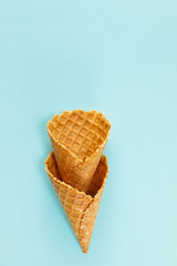 Ice cream cones pattern. Waffle cones on  Background. Minimal composition.