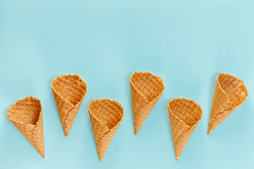 Ice cream cones pattern. Waffle cones on  Background. Minimal composition.