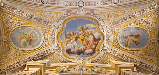 Fototapeta na wymiar OSSUCCIO, ITALY - MAY 8, 2015: The baroque fresco choir of angels with the music instruments in church Sacro Monte della Beata Vergine del Soccorso by Salvatore Pozzi di Puria (1595 – 1681).