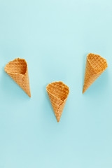 Ice cream cones pattern. Waffle cones on  Background. Minimal composition.