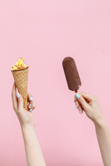 Ice Cream in a waffles cone on color background.