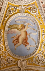 OSSUCCIO, ITALY - MAY 8, 2015: The baroque fresco of angel with the mariological inscriptions in church Sacro Monte della Beata Vergine del Soccorso by Salvatore Pozzi di Puria  (1595 – 1681).