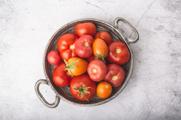 tomatoes in metal bowl